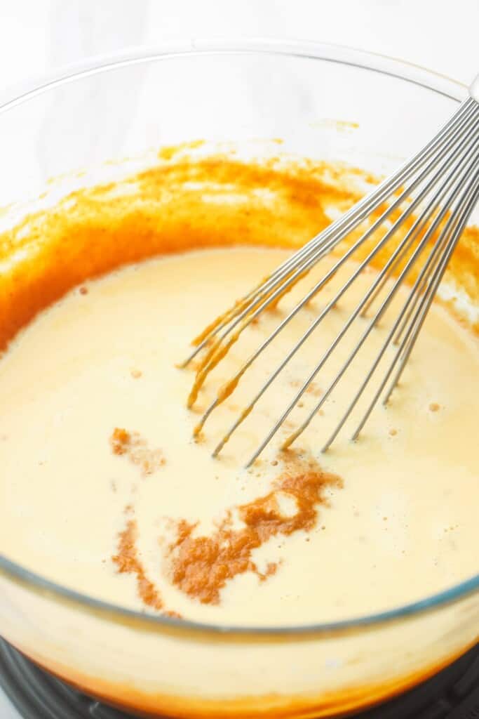 pumpkin pie filling whisked together in a bowl