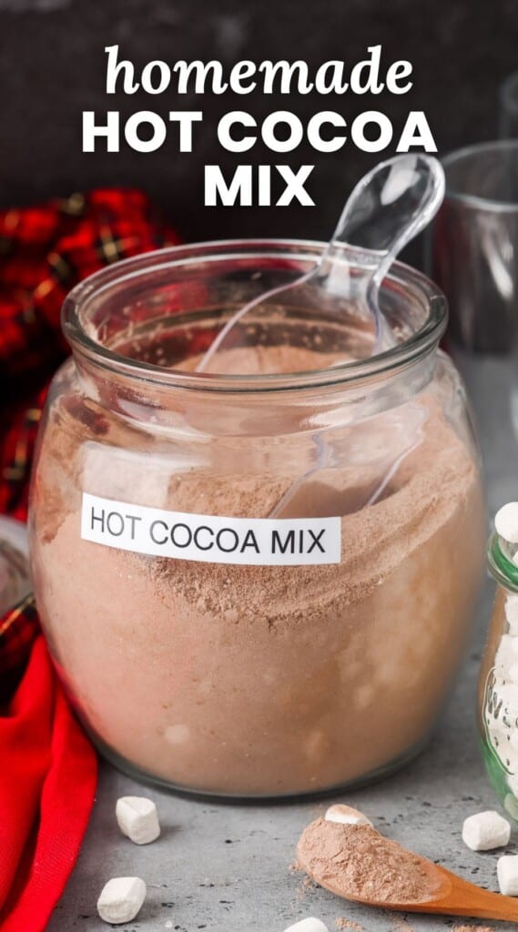 a jar filled with powder, labeled "hot cocoa mix". Text overlay says "homemade hot cocoa mix"