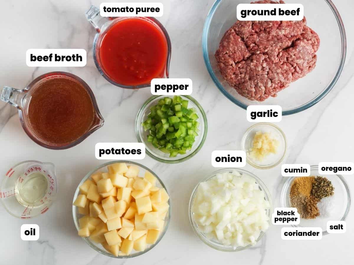 The ingredients needed to make mexican picadillo with beef and potatoes.