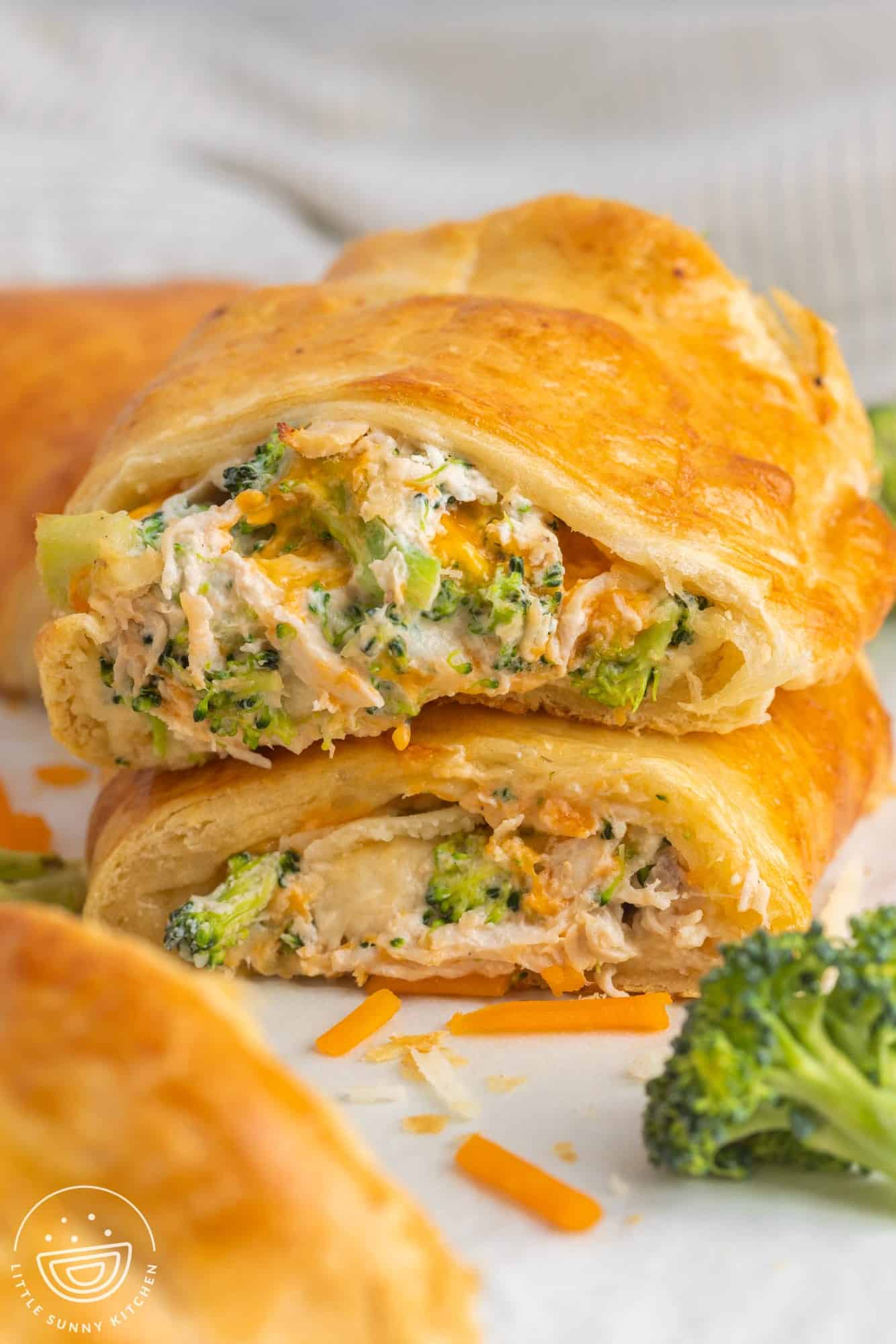 Stacked 2 pieces of crescent bakes filled with cheesy chicken and broccoli