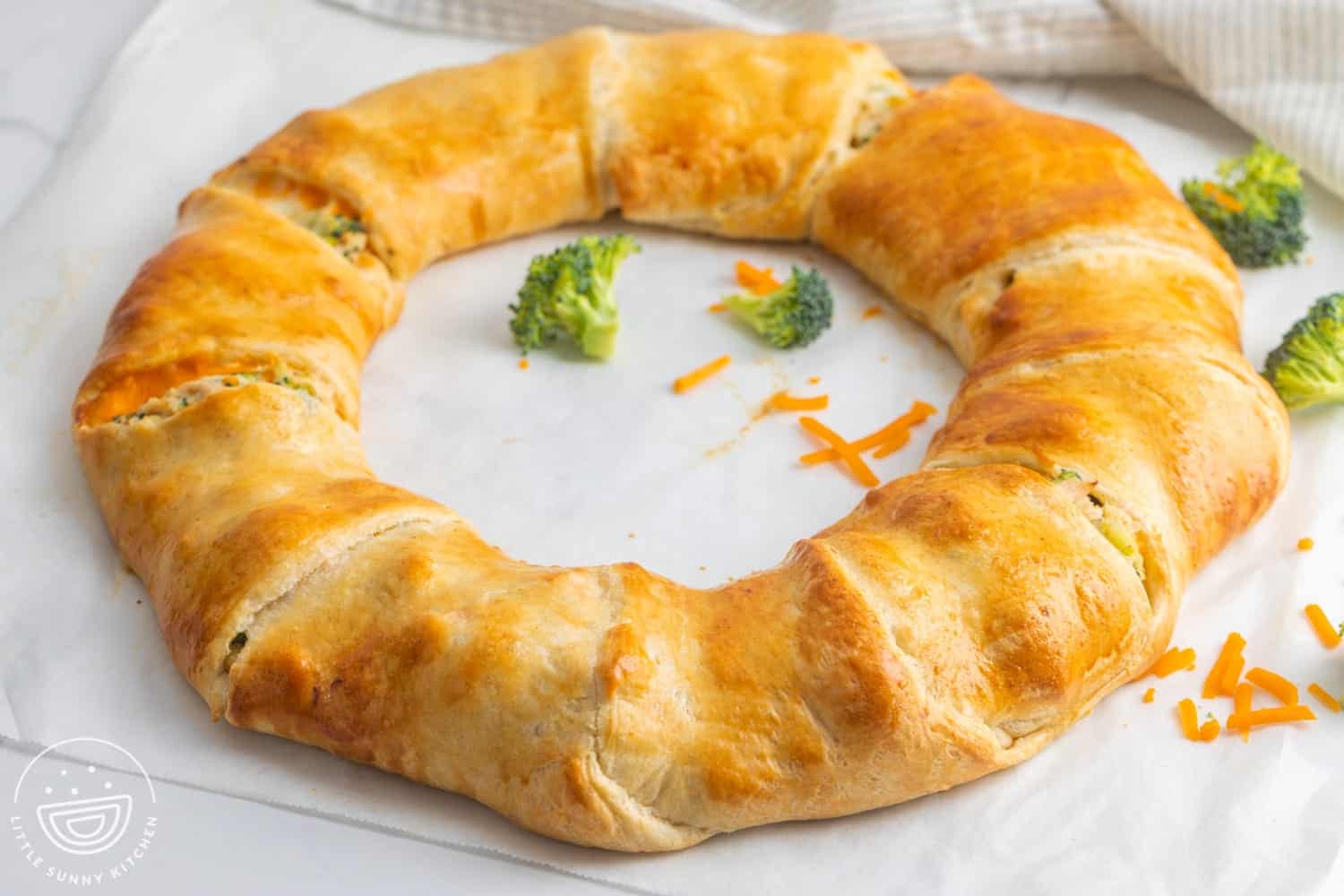 Cheesy Chicken and Broccoli Ring on parchment paper