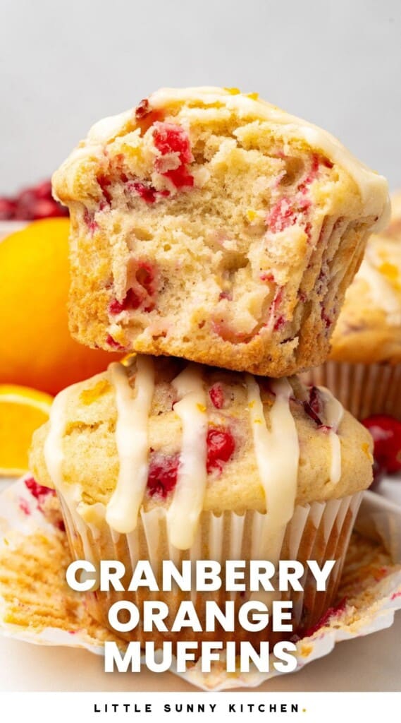two cranberry and orage muffins stacked on top of each other. Text overlay says "cranberry orange muffins"