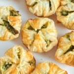 a platter of spinach puffs, viewed from above.