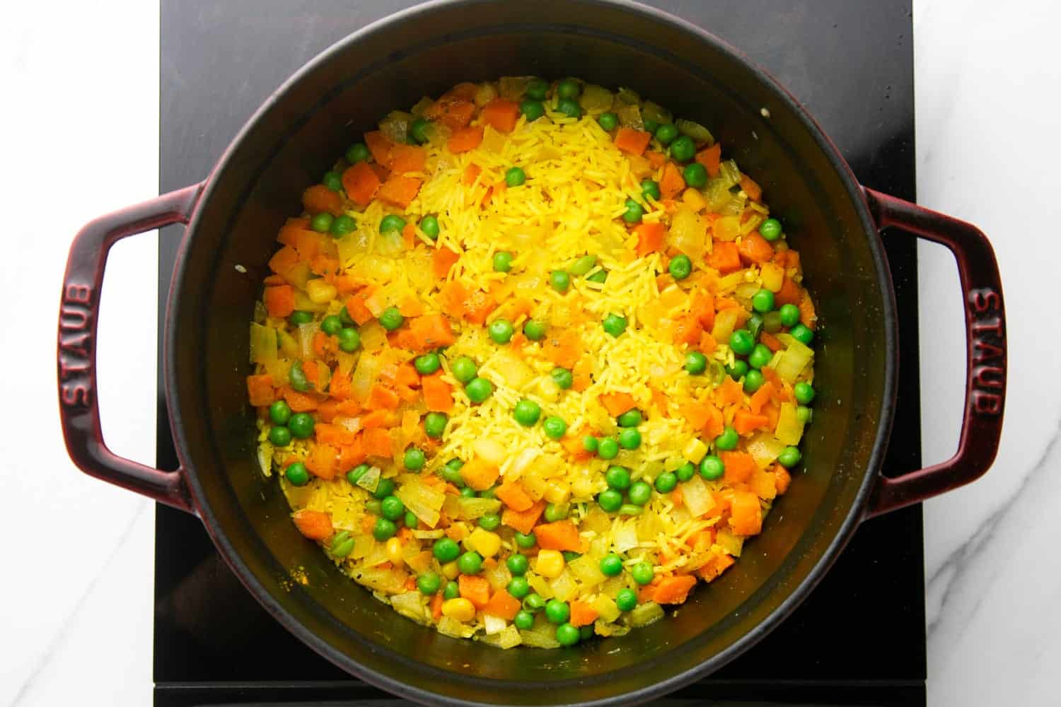 vegetable rice pilaf after steaming in a dutch oven.