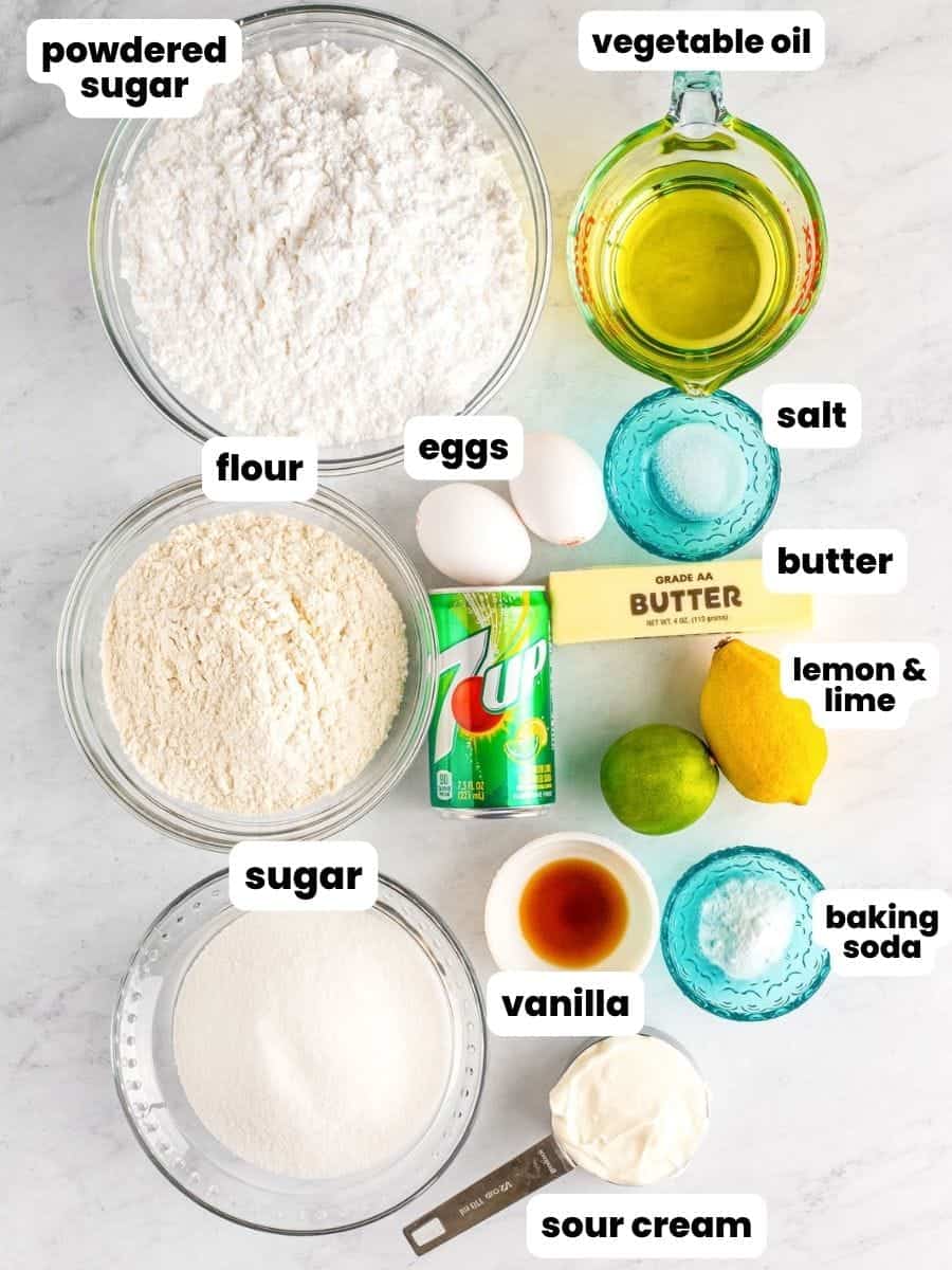 The ingredients needed to make a sheet cake with 7up, including soda, flour, sugar, and eggs.