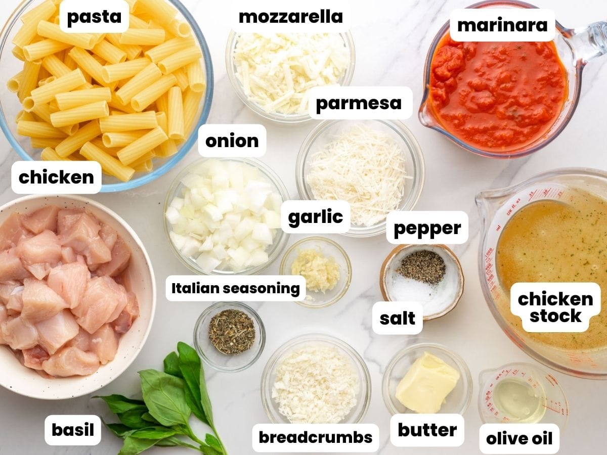 The ingredients needed to make one pot pasta with chicken, parmesan, and tomato sauce