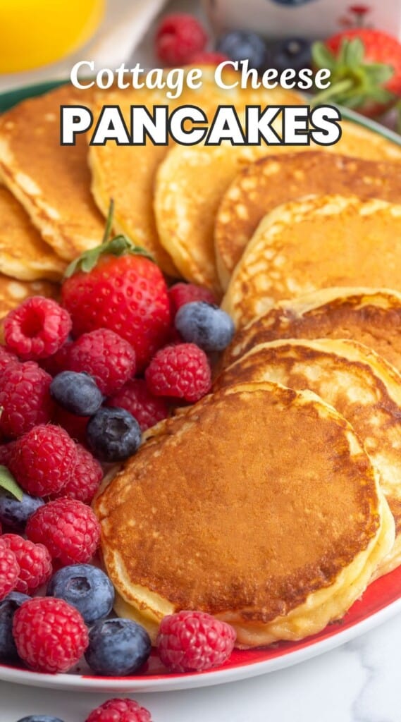 a plate of pancakes and berries. Text overlay says "cottage cheese pancakes"