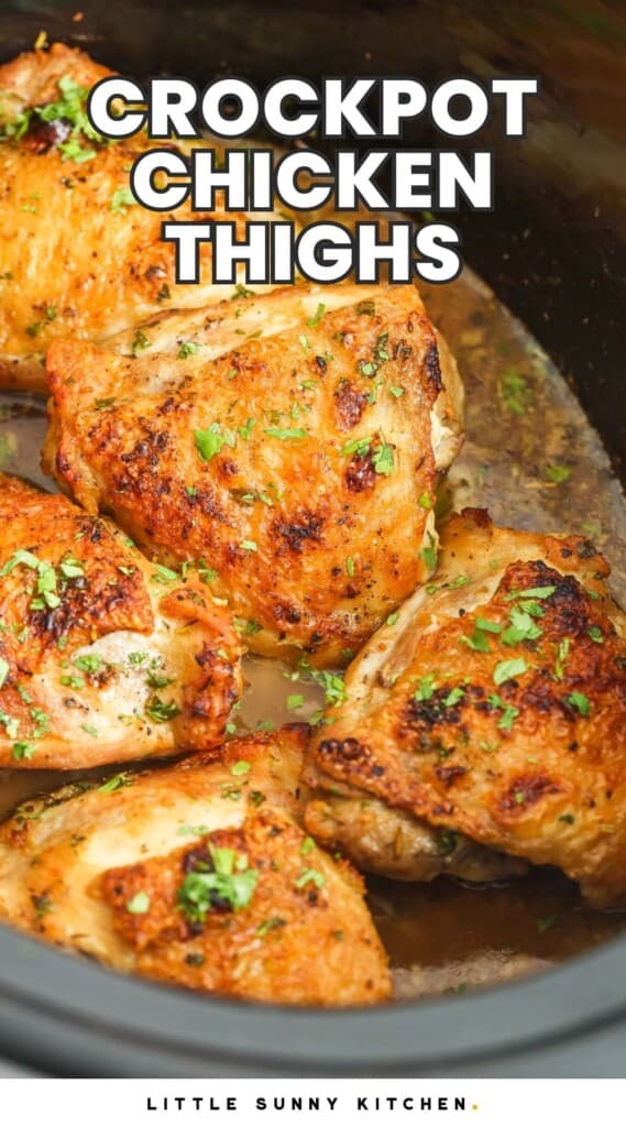 cooked chicken thighs in a slow cooker. text overlay says "crockpot chicken thighs"