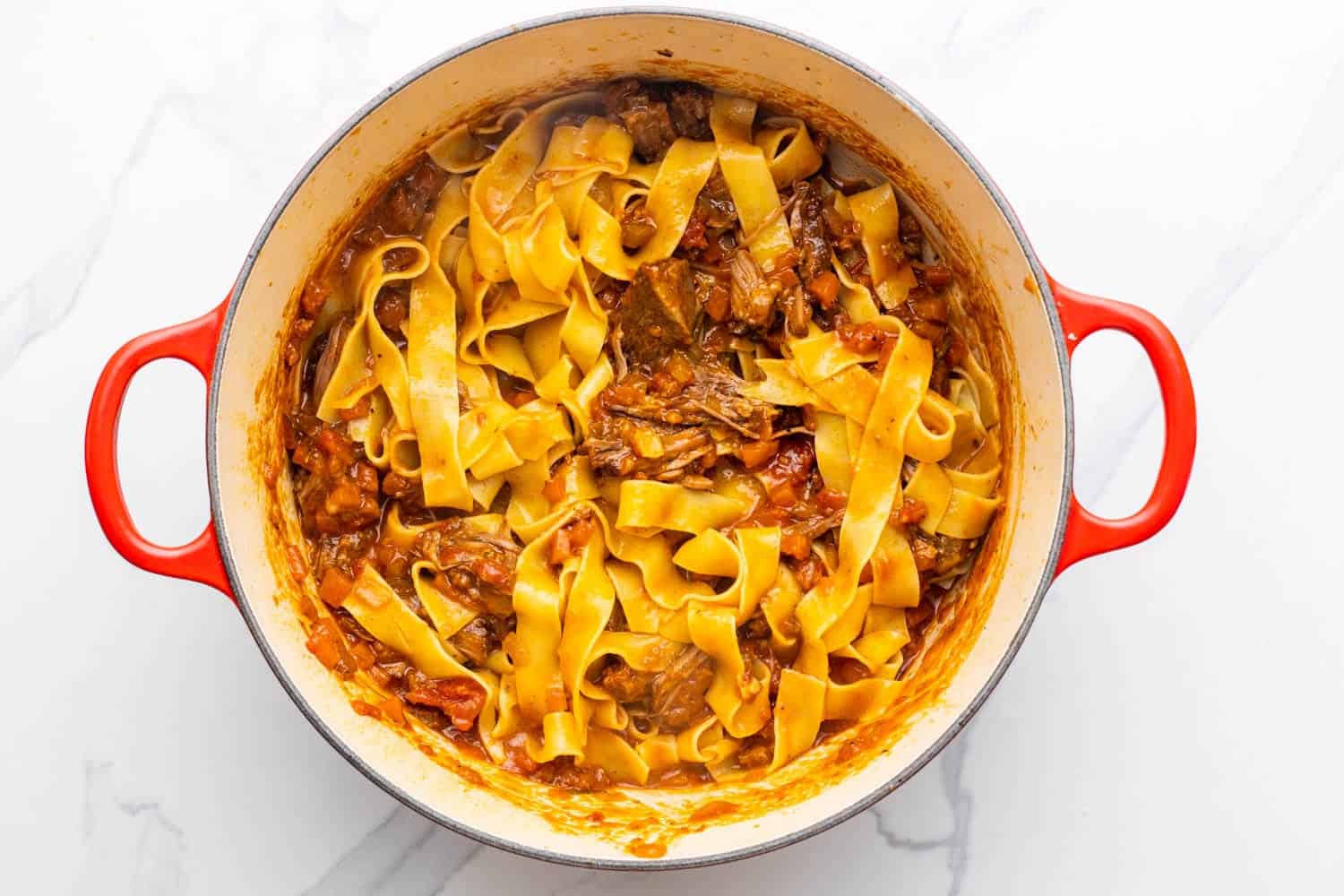 pappardelle pasta tossed with shredded beef ragu. 