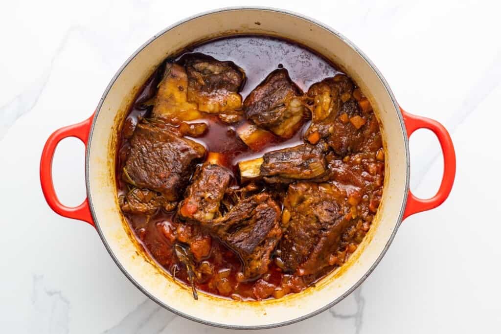 braised short ribs in a dutch oven, the meat is falling off the bones. 