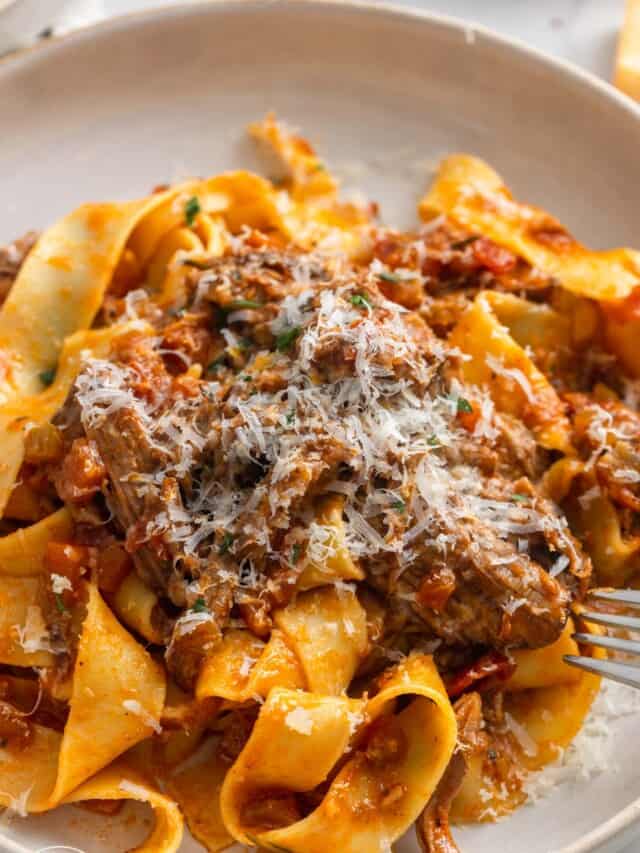 pappardelle with a generous amount of short beef ragu, topped with finely grated parmesan cheese.