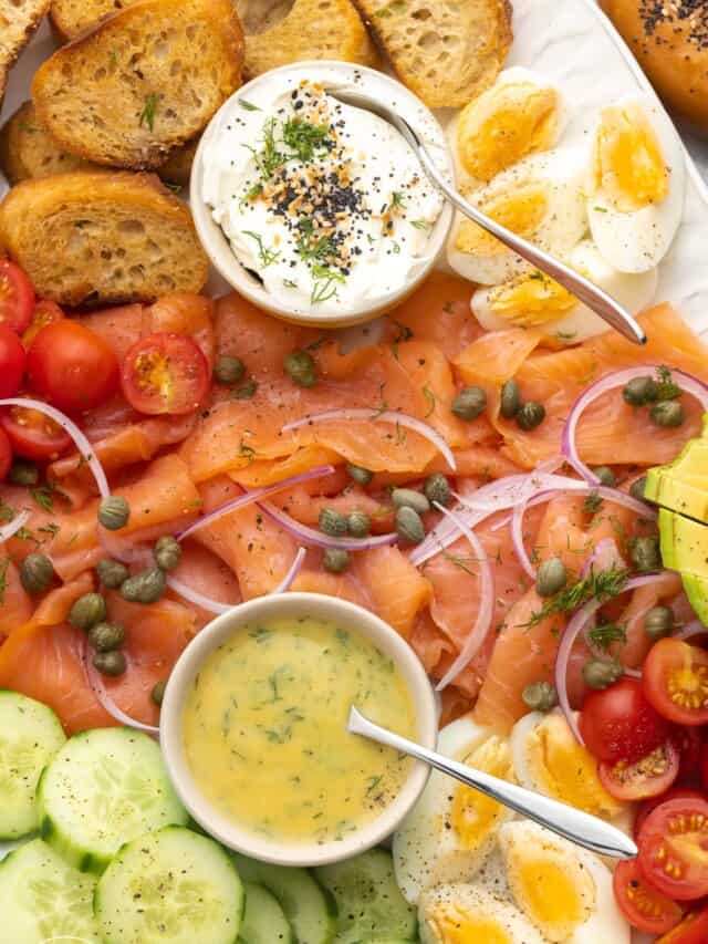 closeup of a smoked salmon platter with homemade sauces.