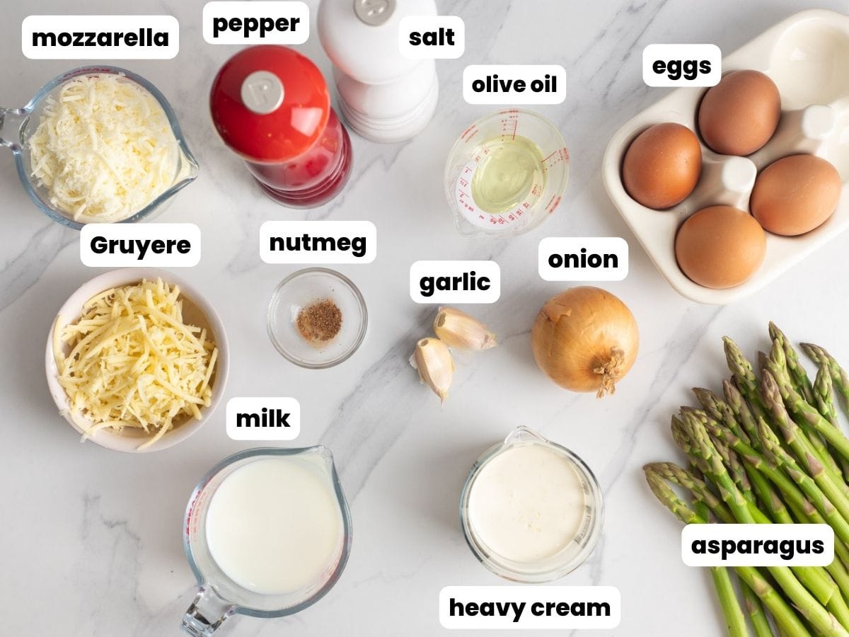 The ingredients needed to make quiche with asparagus, eggs, gruyere, and mozzarella.