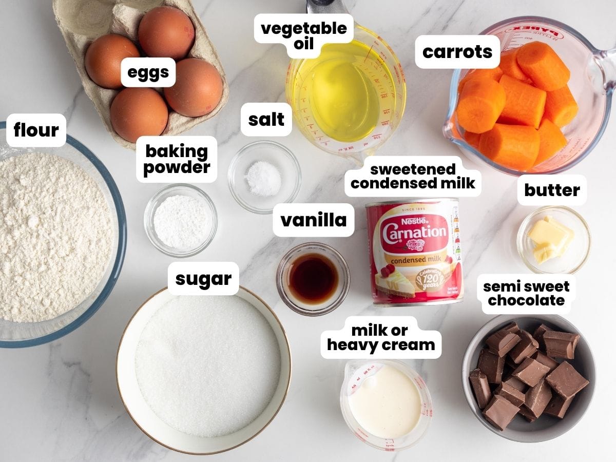 The ingredients needed to make brazilian carrot cake, including sweetened condensed milk, chocolate, and carrots.