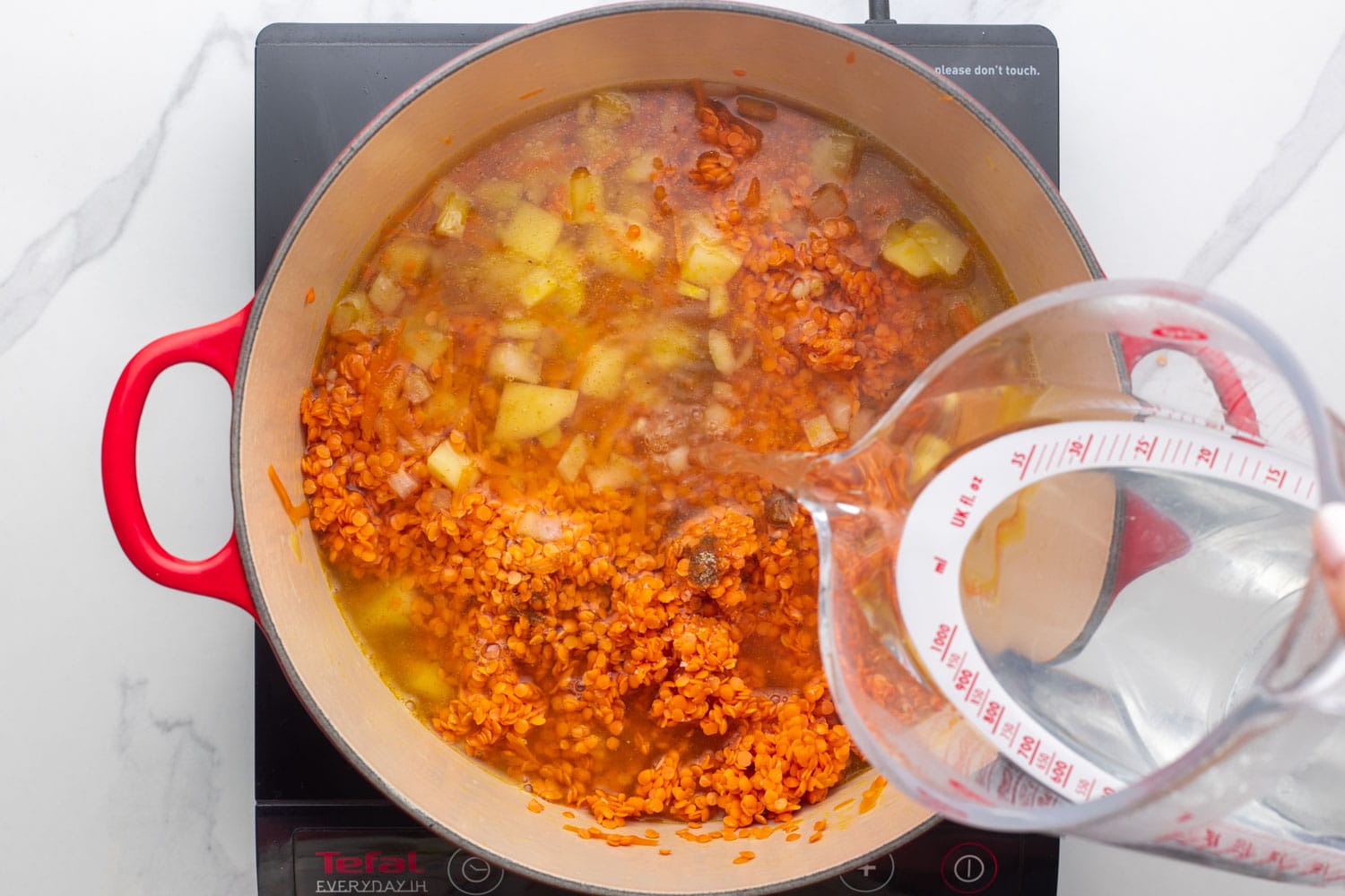 water added to red lentil soup