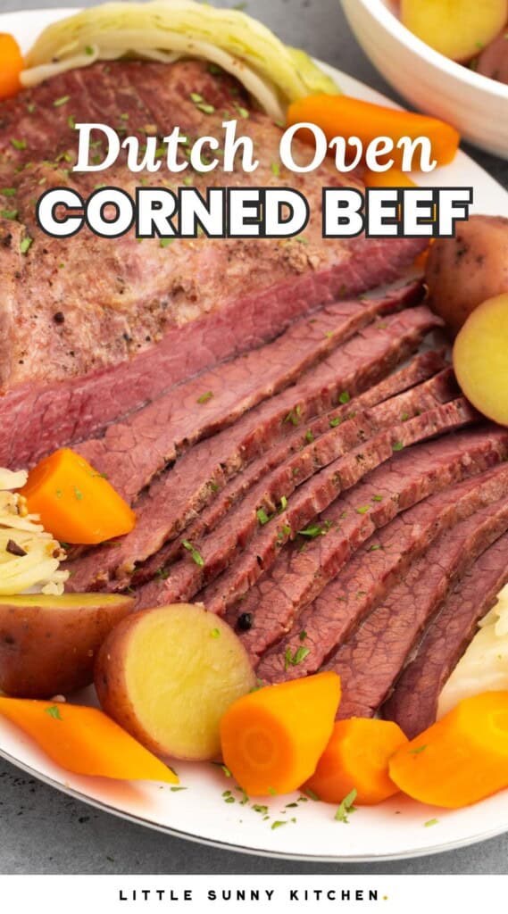 a platter of sliced corned beef with potatoes and carrots. Text overlay says "Dutch oven corned beef"