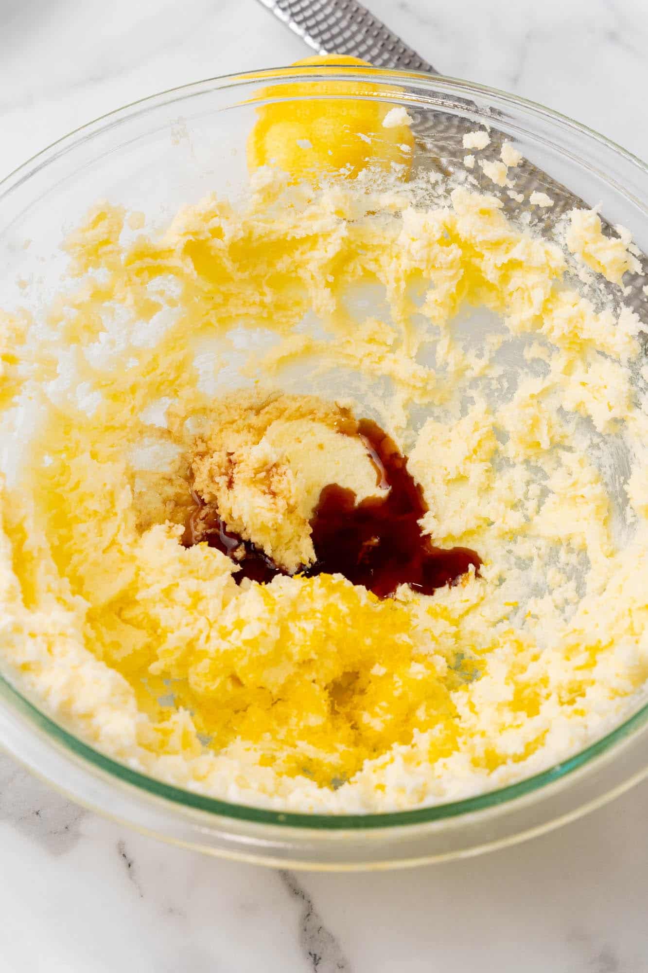 butter and sugar creamed in a bowl. Vanilla has been added.