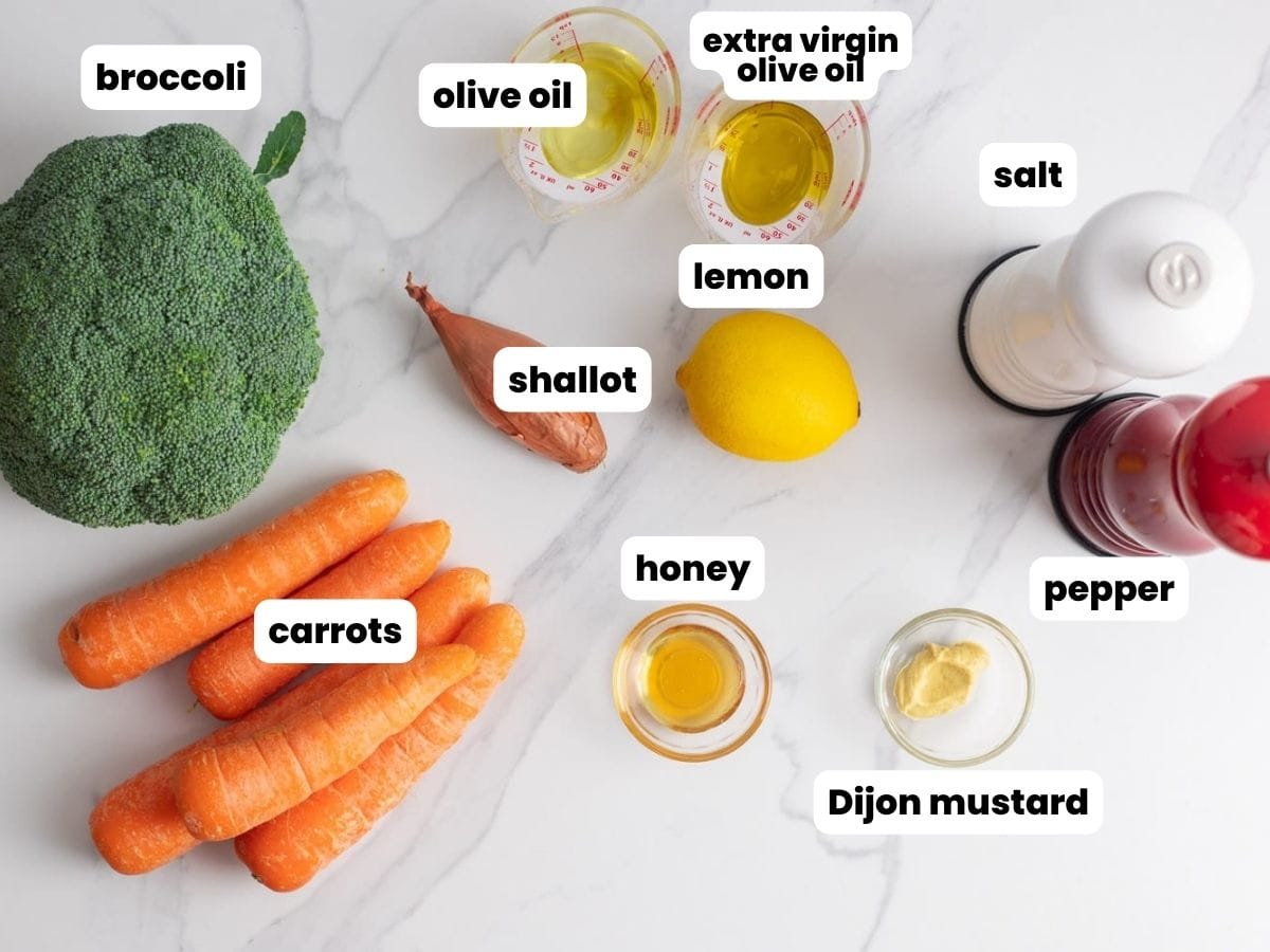 The ingredients needed to make roasted broccoli and carrots with shallot lemon honey sauce.