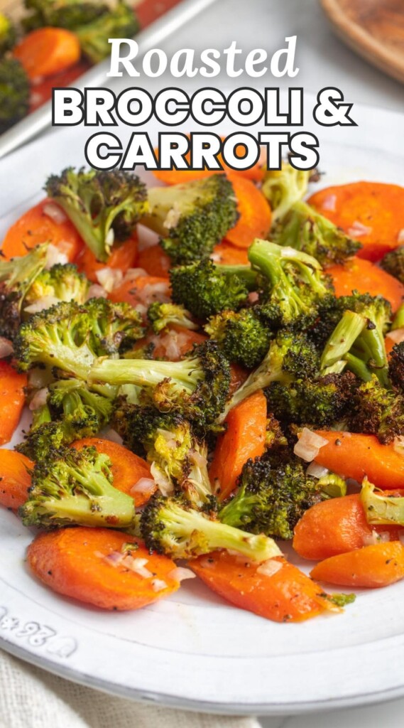 a white ceramic plate holding crispy broccoli and cooked carrots. Text overlay says "roasted broccoli and carrots"
