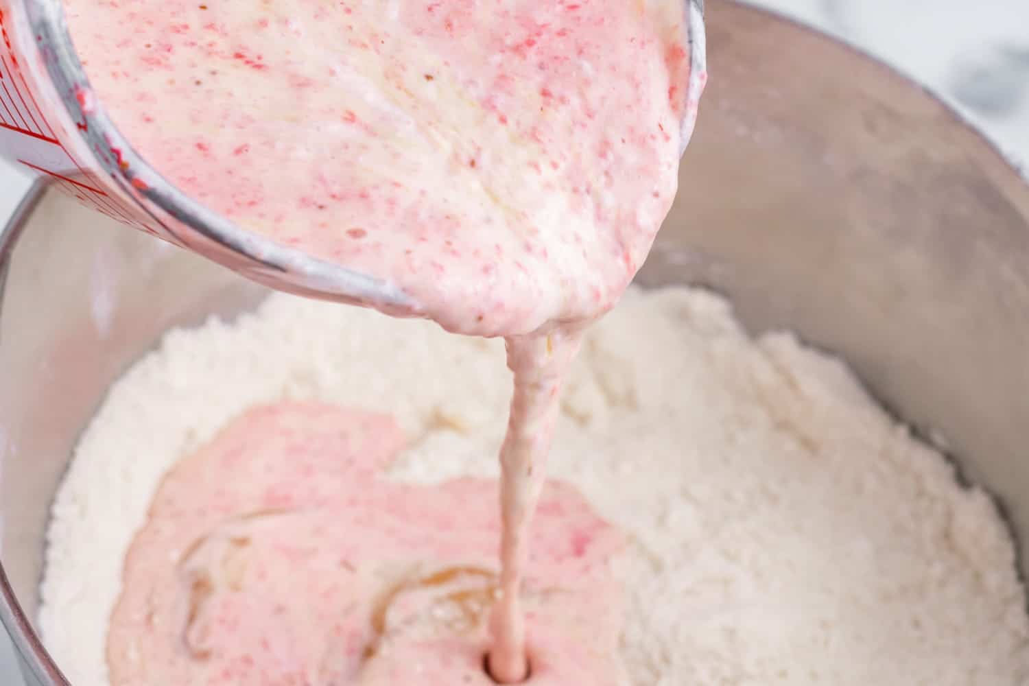 strawberry mixture added to flour to make cake batter.