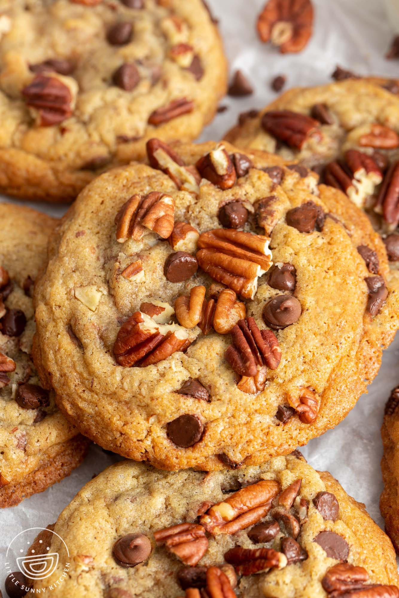 closeup view of perfectly browned pecan chocolate chip cookies.