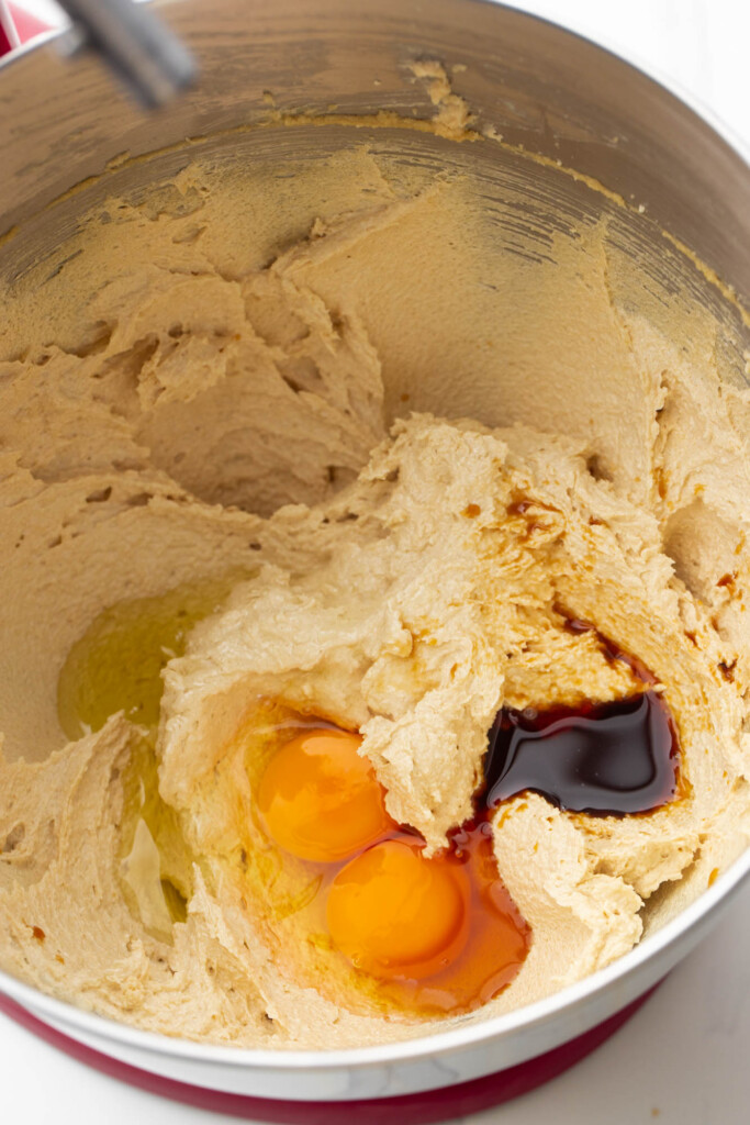 butter and sugars creamed together in a mixer bowl. Eggs and vanilla are added.