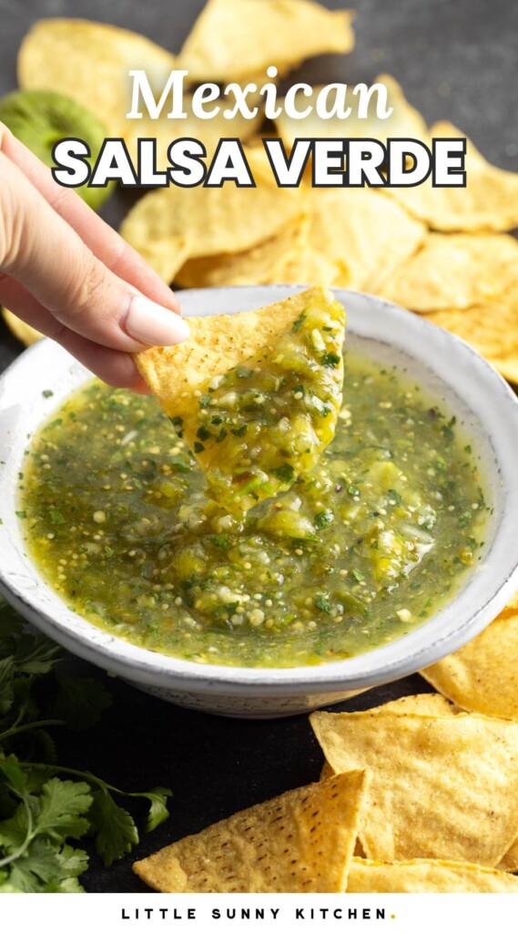 Dipping a tortilla chip in tomatillo salsa in a bowl, and an overlay text that says "Mexican salsa verde"