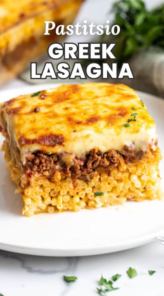 a square piece of lasagna made with tube noodles, meat sauce, and cheese. Text overlay says Pastitsio Greek Lasagna