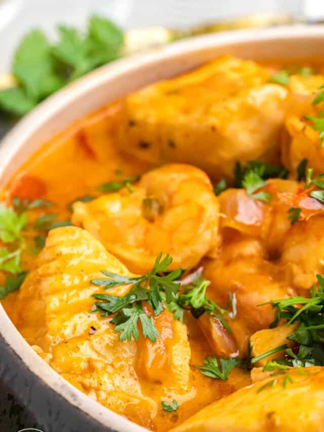 closeup of a bowl of brazilian fish stew, garnished with fresh cilantro.