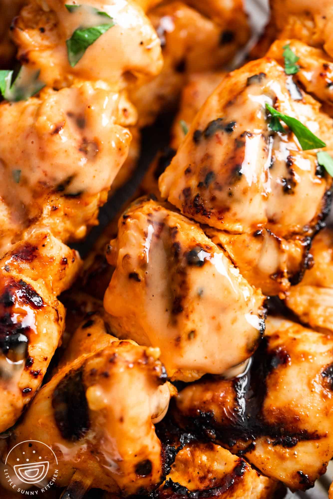 grilled chicken skewers with bang bang sauce.