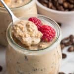 Taking a spoonful of coffee overnight oats from a jar