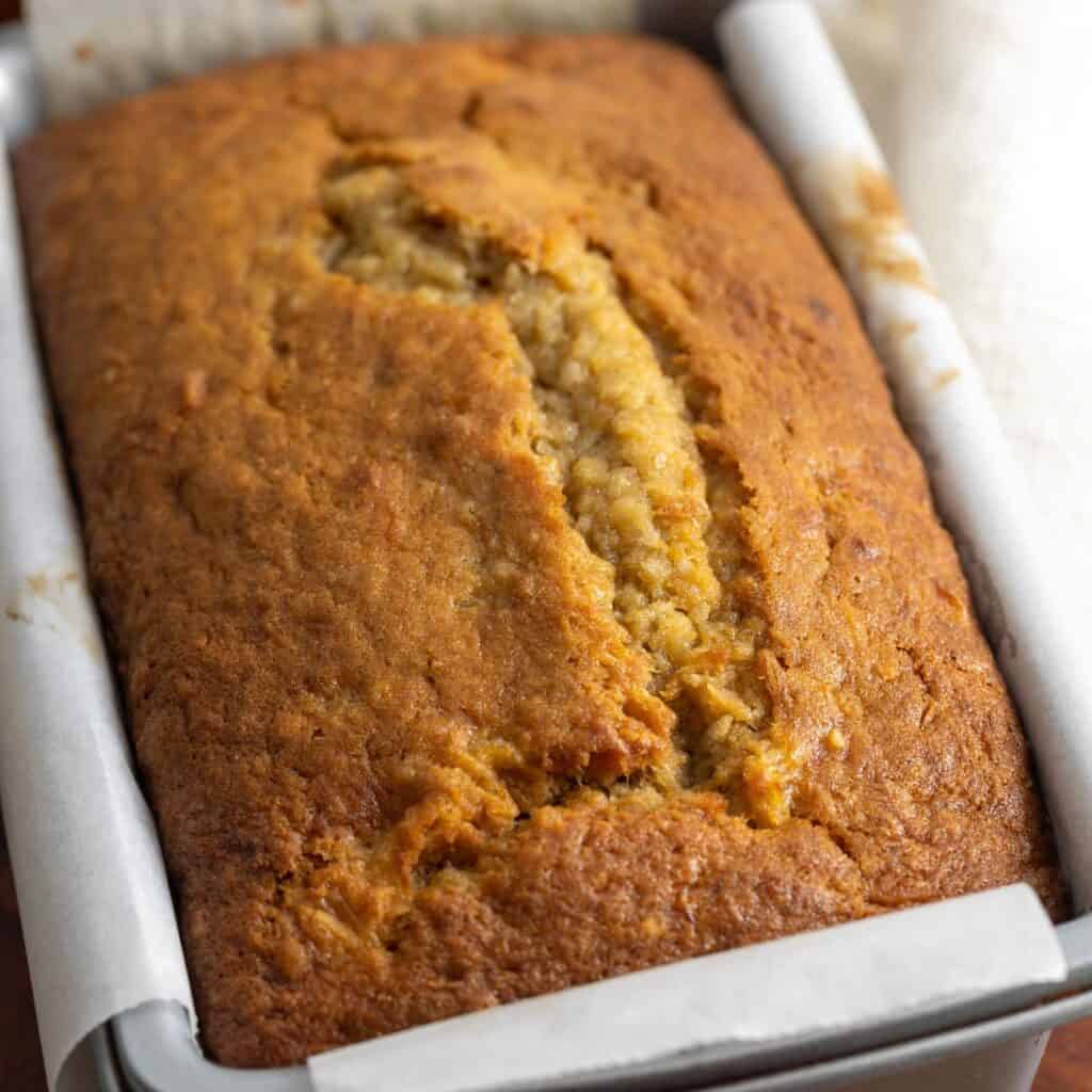 closeup of a loaf of hawaiian banana bread in the pan.