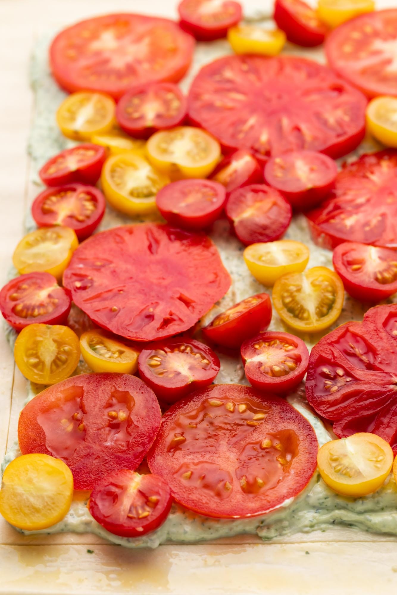 sliced fresh tomatoes added to ricotta filling to make a tomato tart