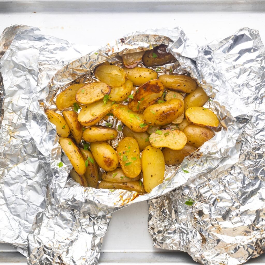 grilled potatoes inside of foil packets.