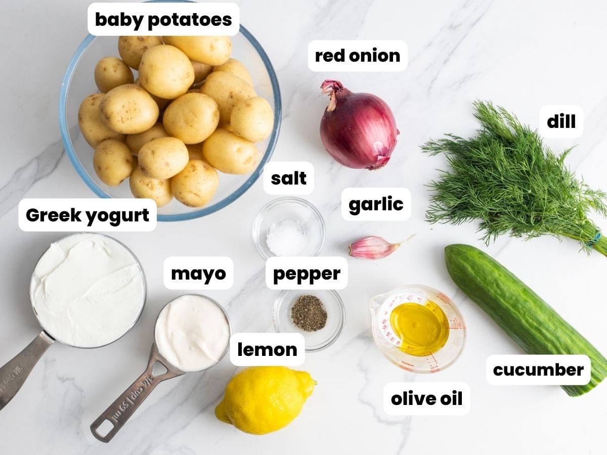 The ingredients needed to make smashed potato salad with baby potatoes and greek yogurt tzatziki sauce.