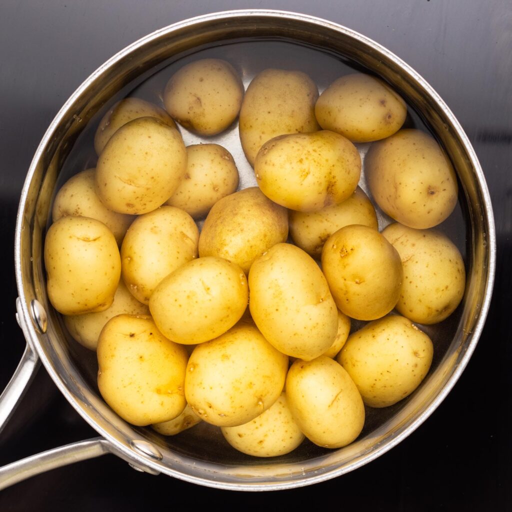 baby white potatoes in a pot of water, viewed from overhead