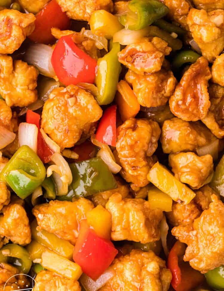 Overhead shot of sweet and sour chicken, close up shot format.