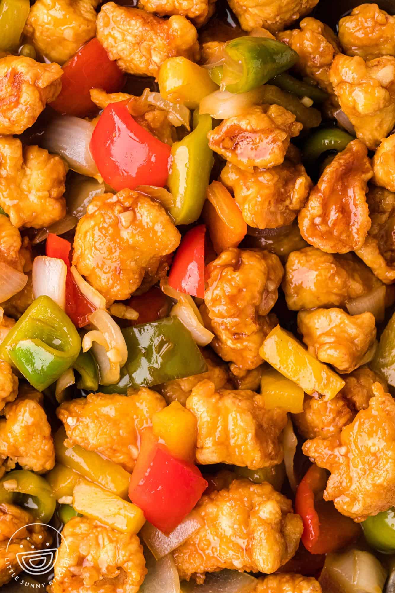 Overhead shot of sweet and sour chicken, close up shot format.