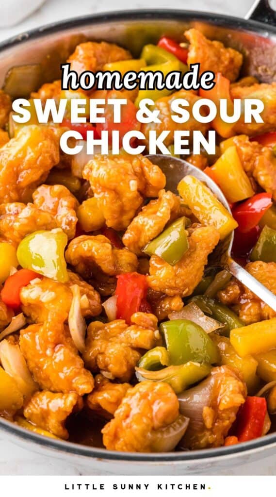 Sweet and Sour Chicken in a stainless steel skillet with a serving spoon. And overlay text that says "homemade sweet & sour chicken"