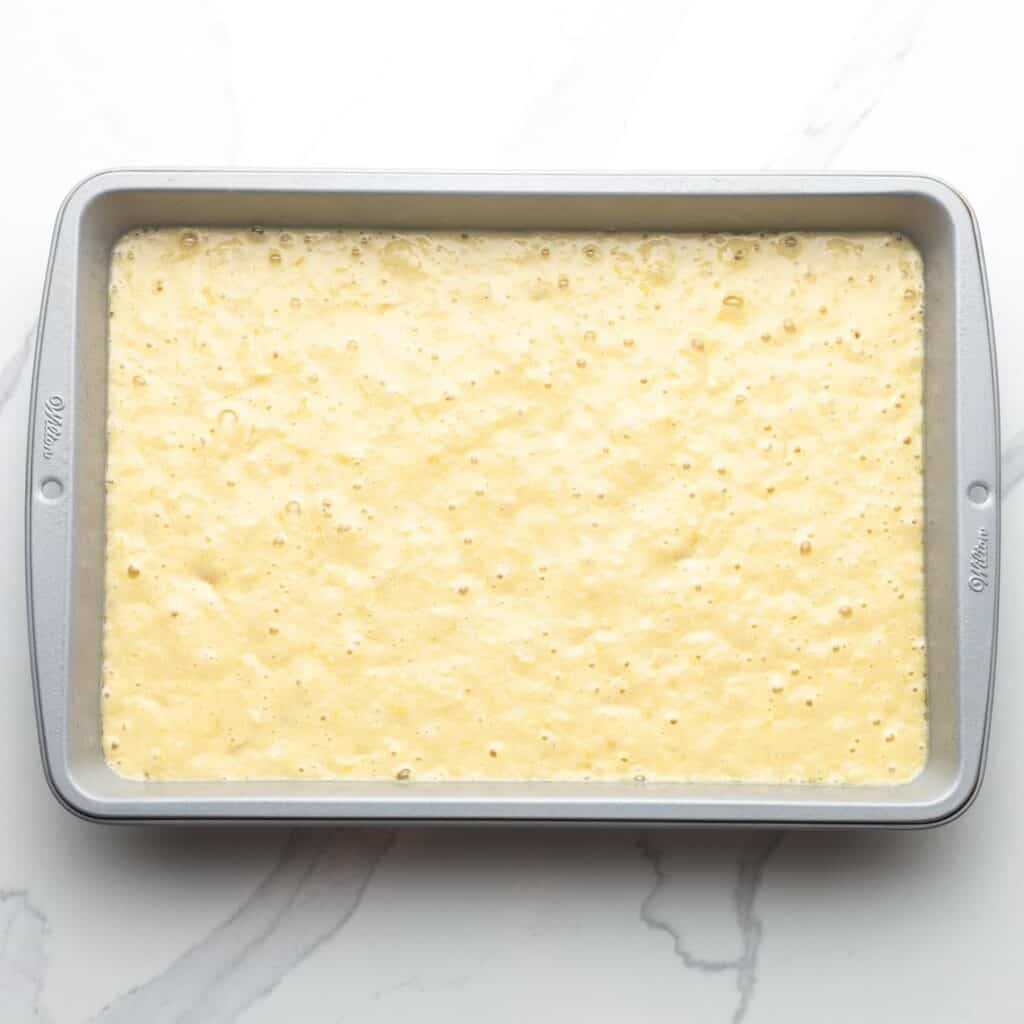 Do Nothing Cake Batter poured into a 9x13-inch baking pan.