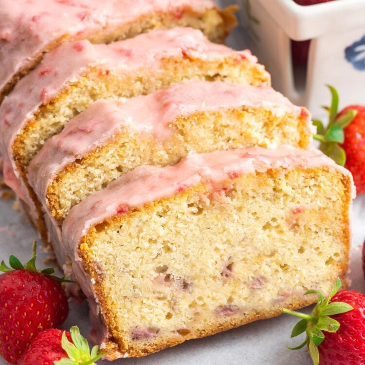 sliced strawberry pound cake with strawberry icing.