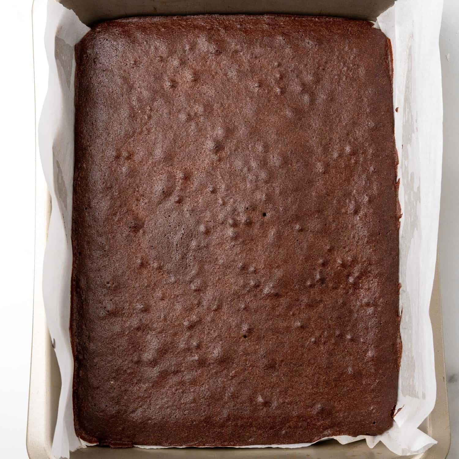 baked brownies in a metal pan.