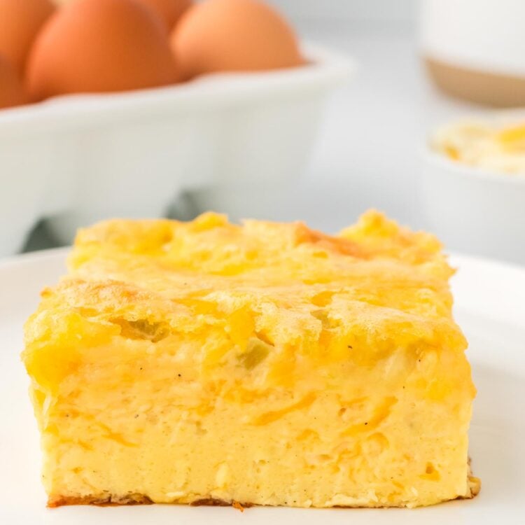 a square piece of crustless egg casserole with green chiles and cheese.