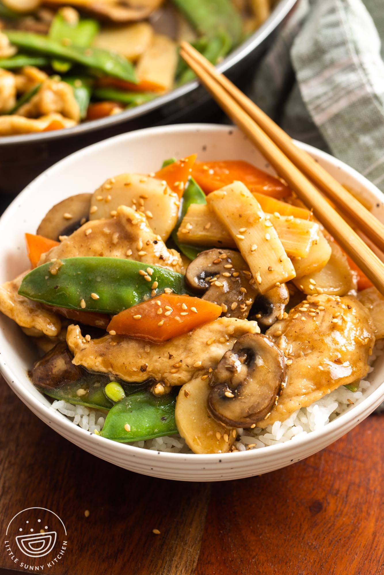 a bowl of rice topped with homemade moo goo gai pan.