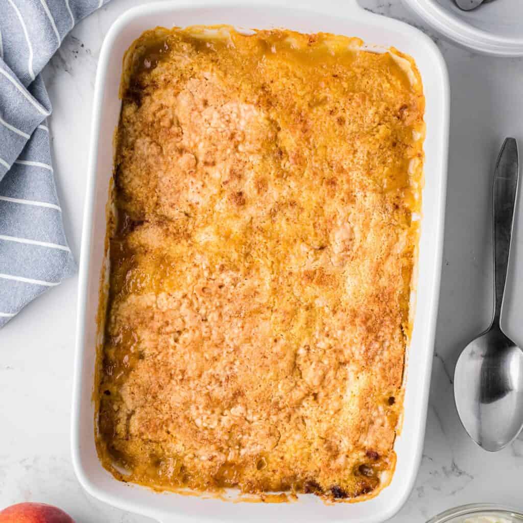 baked peach dump cake with golden brown topping.