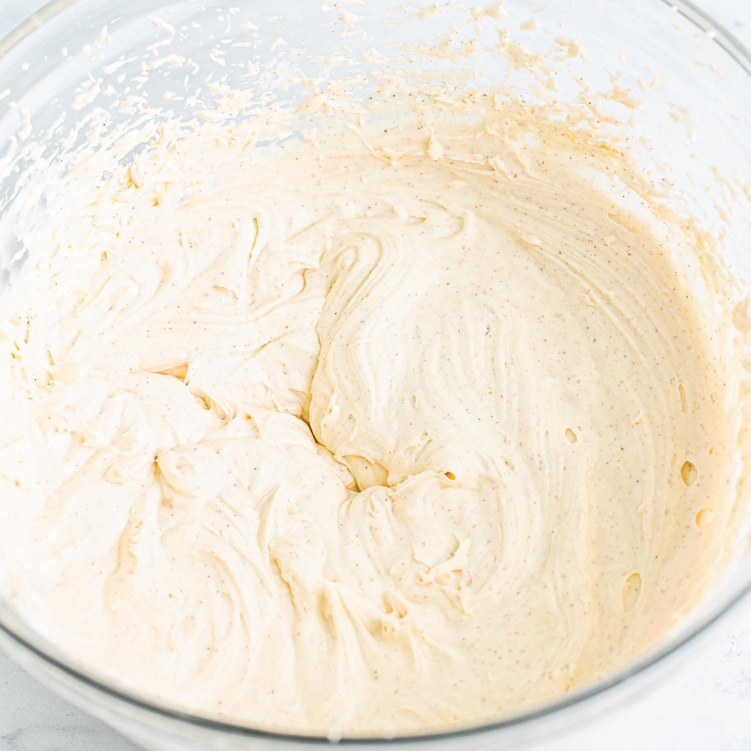 whipped pumpkin spice buttercream in a glass bowl.