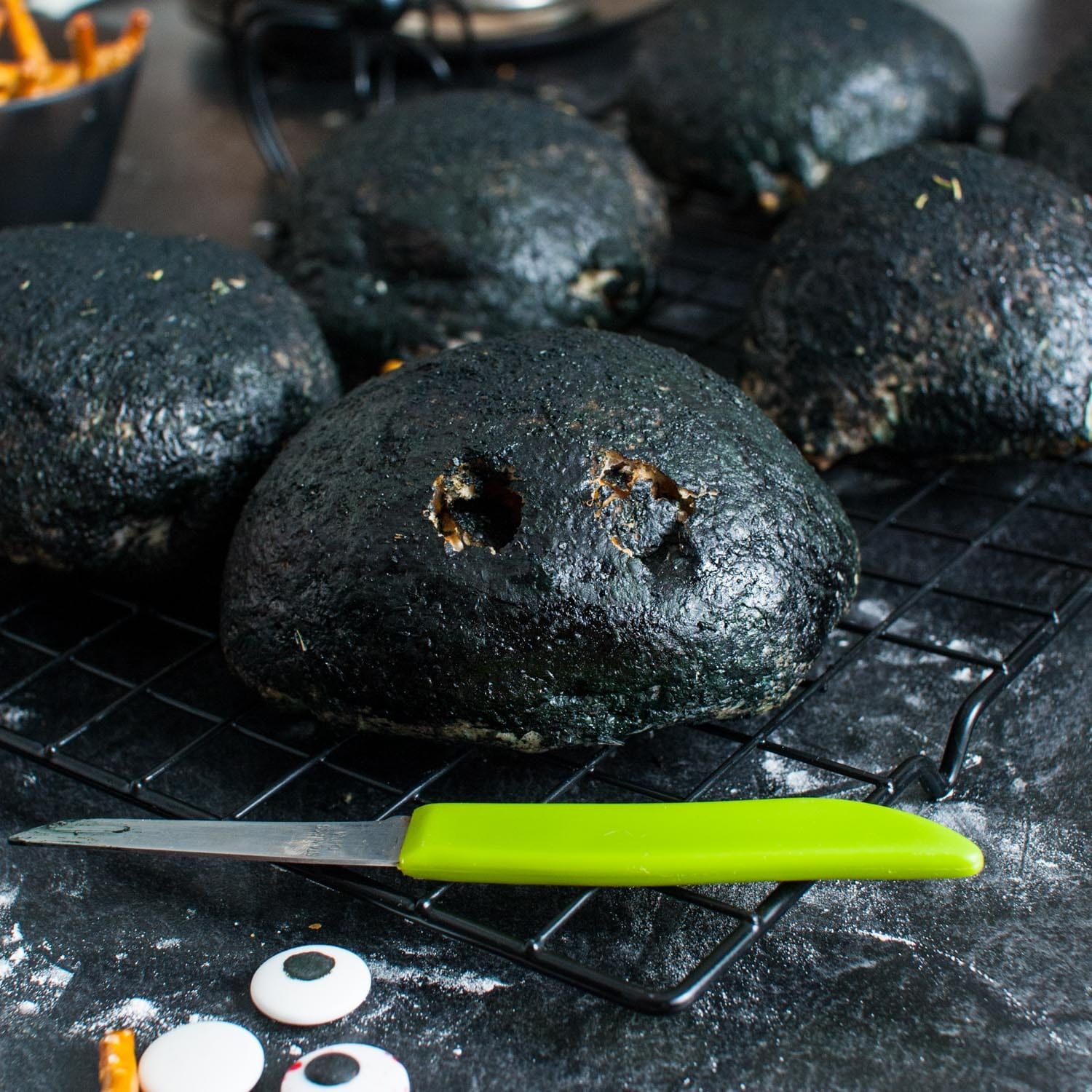 a knife has made two holes in the side of a black buffalo chicken bomb