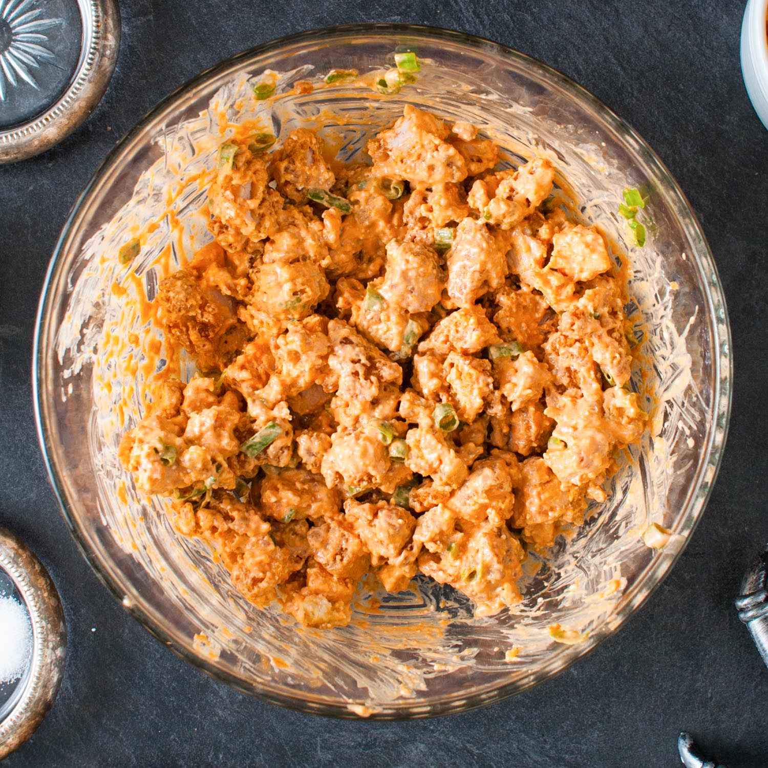 crispy chicken pieces coated with buffalo wing sauce and cream cheese.