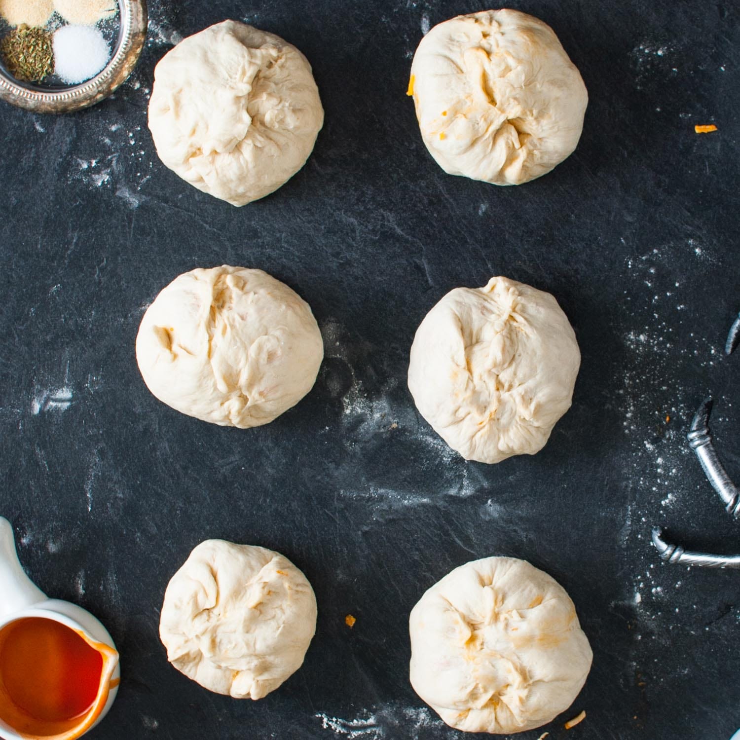 uncooked dough balls filled with buffalo chicken.