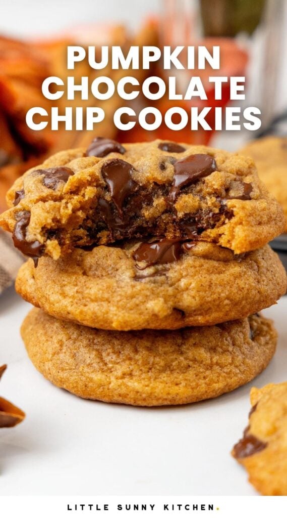 a photo of three pumpkin chocolate chip cookies, stacked. Text overlay says "pumpkin chocolate chip cookies" in capitalized white letters.